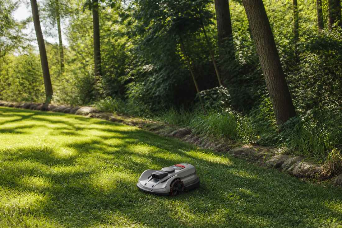 sunseeker elite x7 plus gen2 lawn mower grassy field