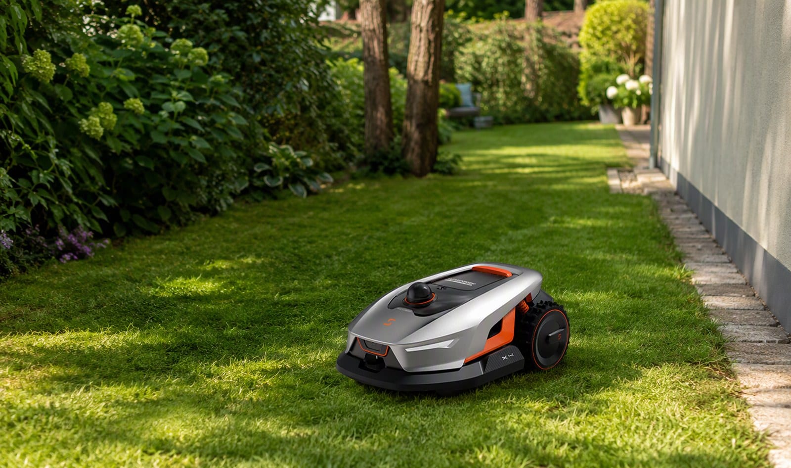 Sunseeker X4 robot mower on a small lawn